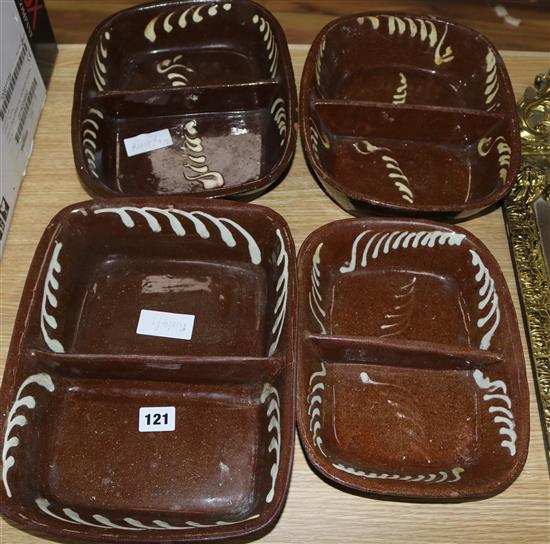 Four 19th century slipware baking dishes